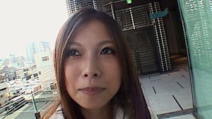 Cute Japanese shows off her shaved pussy